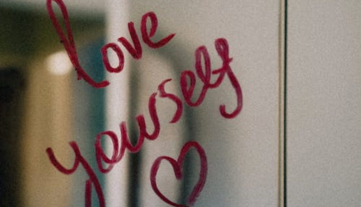 Woman practicing self-esteem counseling and self-compassion with love yourself message